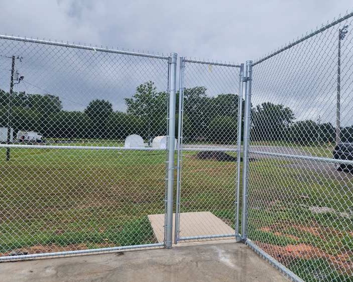 Chainlink fence installation in Cullman Alabama at worksite.