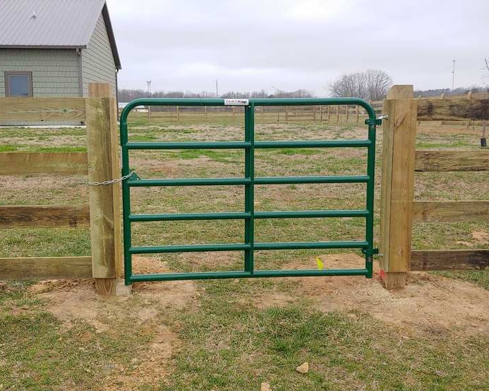 Ranch rail fence with ranch gate.